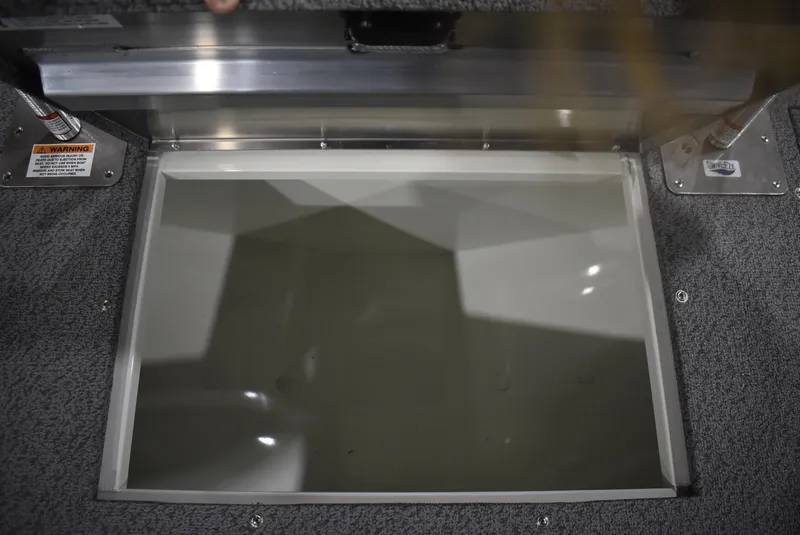 Slide: The Image of Open storage compartment on 2025 Lowe SD224 Sport Deck boat. - 21