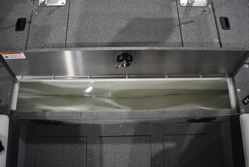 Slide: The Image of 2025 Lowe SD224 Sport Deck boat storage compartment, open and empty, with gray interior. - 22