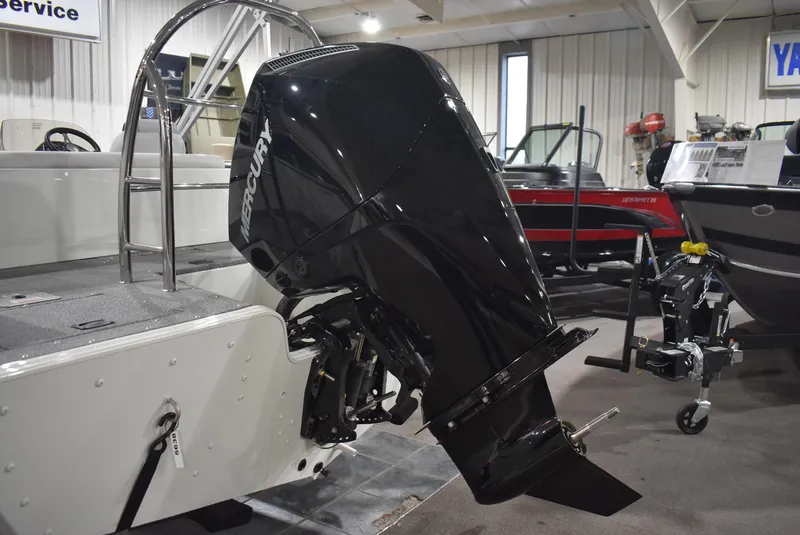 Slide: The Image of 2025 Lowe SD224 Sport Deck boat with Mercury outboard motor in showroom. - 3