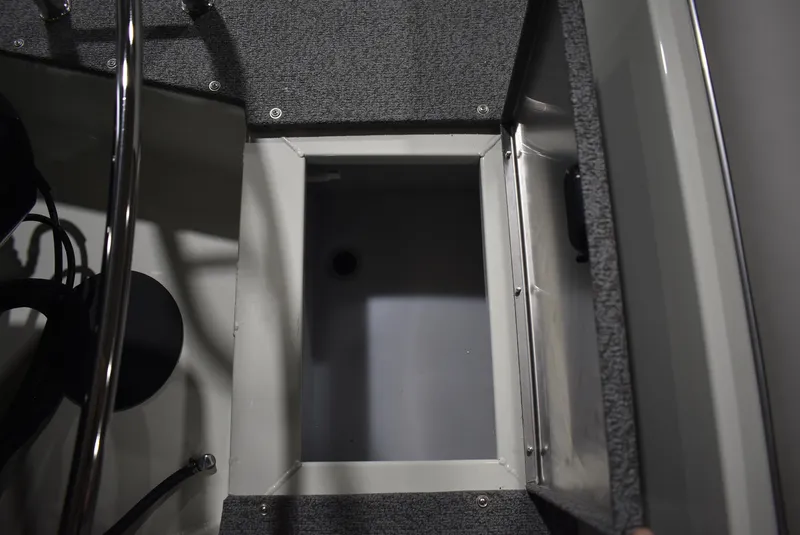 Slide: The Image of Open storage compartment on 2025 Lowe SD224 Sport Deck boat. - 6