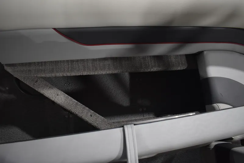 Slide: The Image of Interior view of 2025 Lowe SD224 Sport Deck boat, featuring seating and storage area. - 9