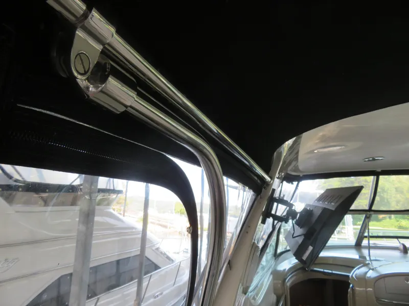 Slide: The Image of Interior view of a 2001 Sea Ray 510DA yacht, featuring sleek metal fittings. - 12