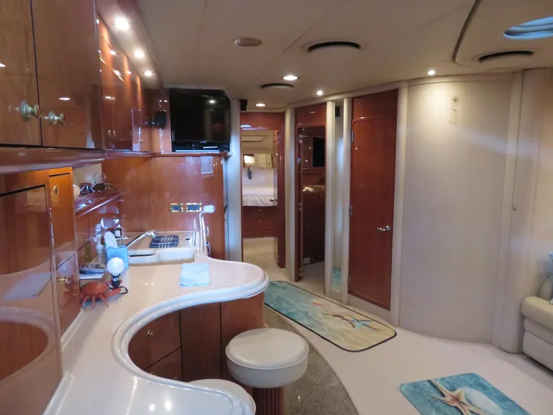 Slide: The Image of Luxurious interior of 2001 Sea Ray 510DA yacht with modern amenities and elegant design. - 13