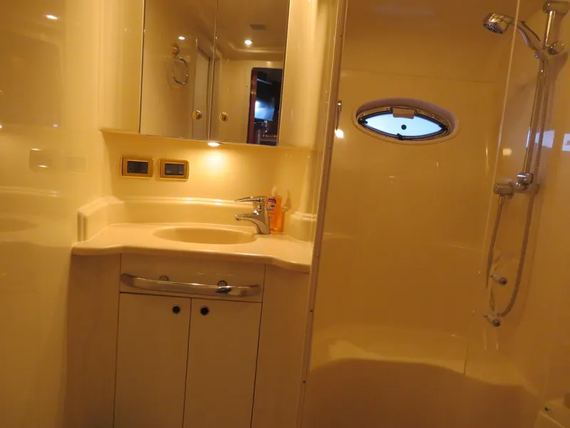 Slide: The Image of Luxurious bathroom in a 2001 Sea Ray 510DA yacht with shower and vanity. - 18