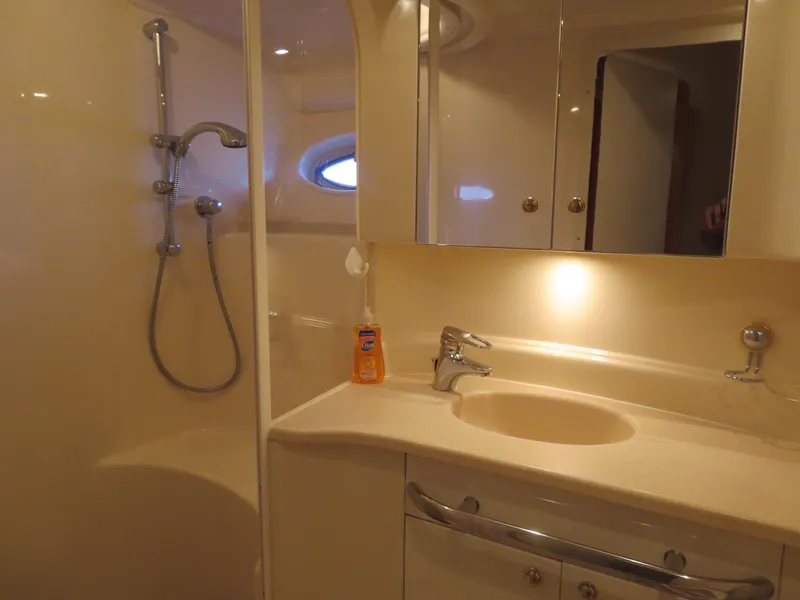 Slide: The Image of Luxurious bathroom in 2001 Sea Ray 510DA yacht with shower and sink. - 21