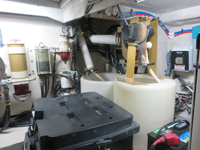 Slide: The Image of Engine room of a 2001 Sea Ray 510DA yacht with mechanical components and wiring. - 25