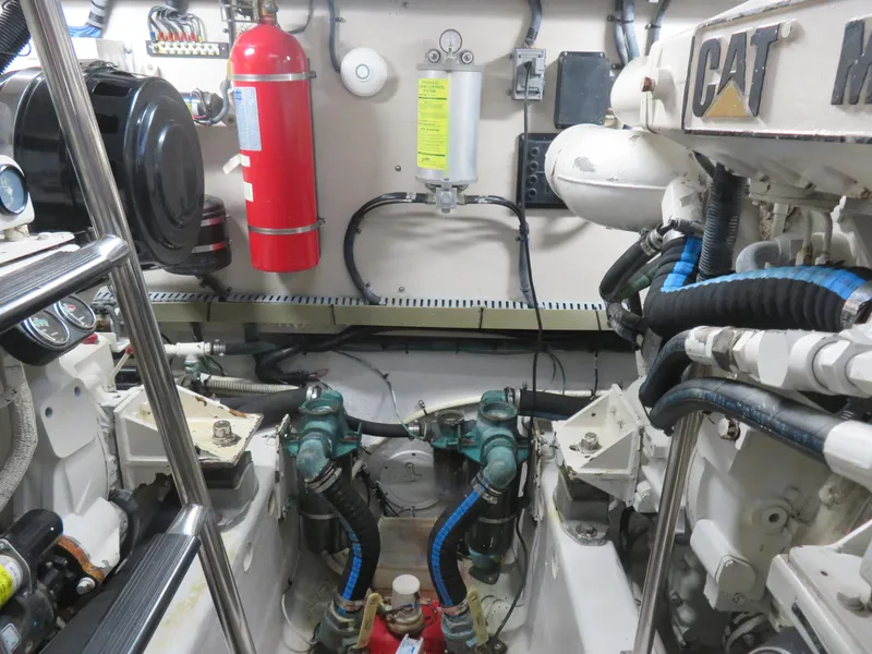 Slide: The Image of Engine room of 2001 Sea Ray 510DA yacht with CAT machinery and fire extinguisher. - 27