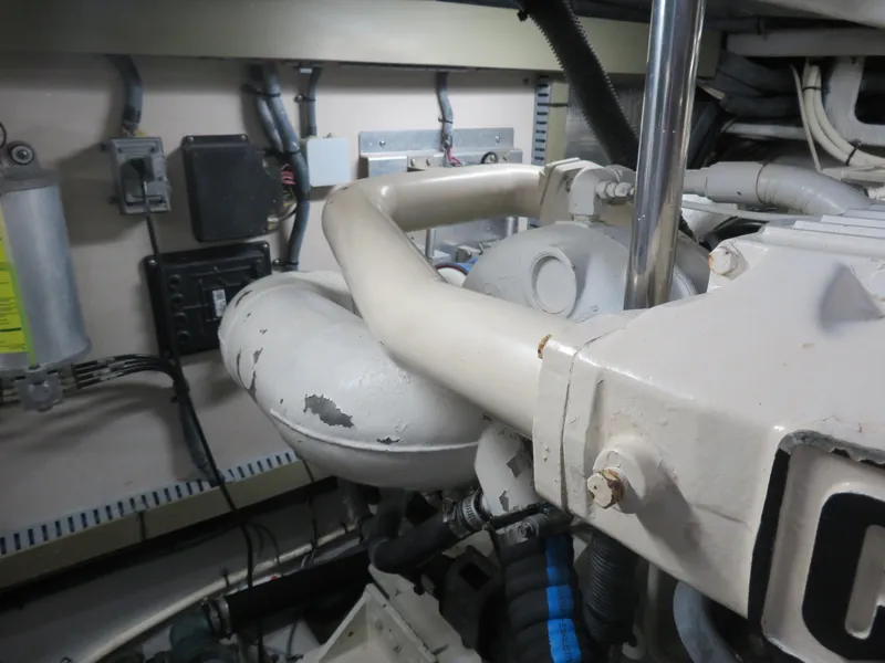 Slide: The Image of Engine room of a 2001 Sea Ray 510DA yacht, showcasing mechanical components and wiring. - 31