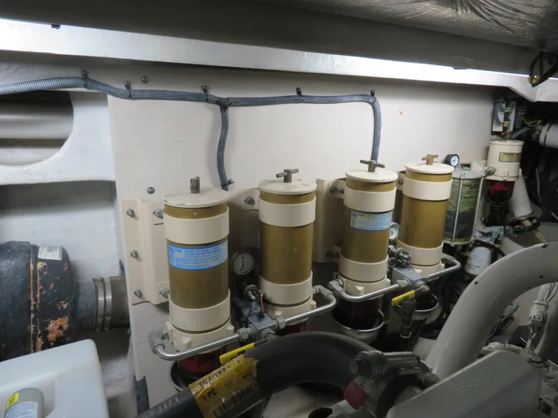 Slide: The Image of Engine room of 2001 Sea Ray 510DA yacht with fuel filters and piping system. - 33