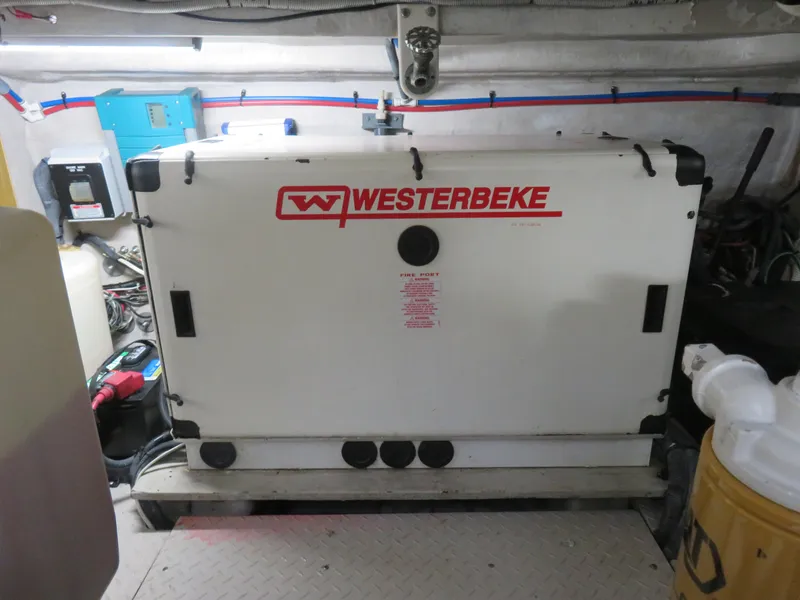 Slide: The Image of Westerbeke generator in a 2001 Sea Ray 510DA engine room. - 34