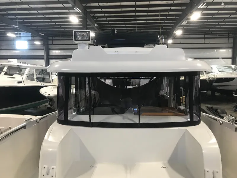 Slide: The Image of 2013 Beneteau Barracuda 9 boat in indoor storage, front view. - 10