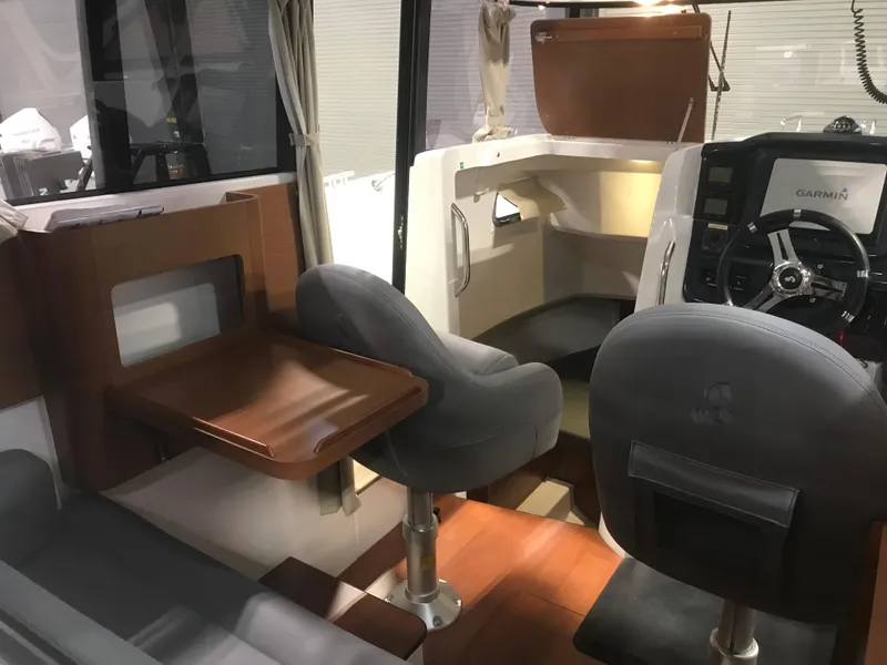 Slide: The Image of Interior of 2013 Beneteau Barracuda 9 boat with seating and navigation area. - 15