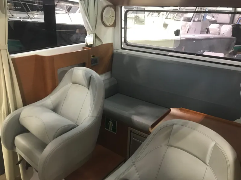 Slide: The Image of Interior of 2013 Beneteau Barracuda 9, featuring comfortable seating and modern design. - 16