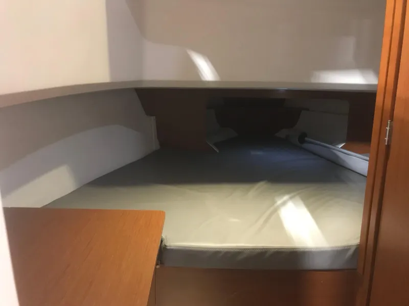 Slide: The Image of 2013 Beneteau Barracuda 9 cabin interior with bed and wooden furnishings. - 19