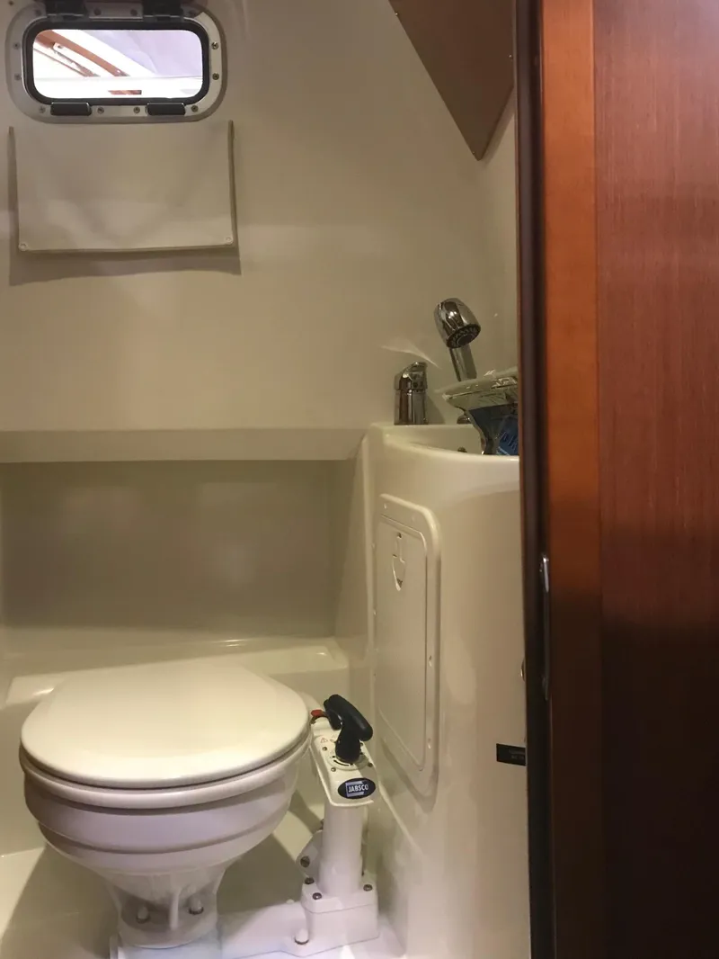 Slide: The Image of 2013 Beneteau Barracuda 9 boat bathroom interior with toilet and sink. - 20