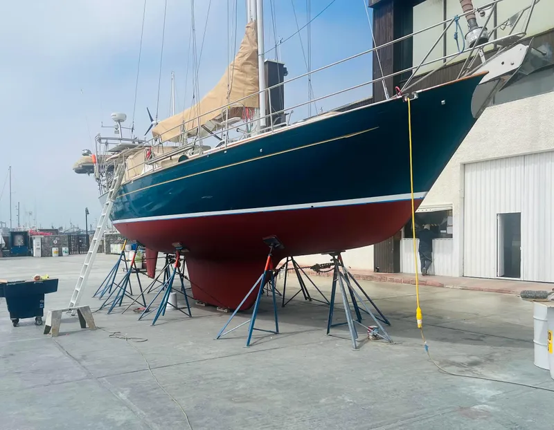 Slide: The Image of Sailboat Passport Royal 43, 1999 model, on dry dock for maintenance. - 5