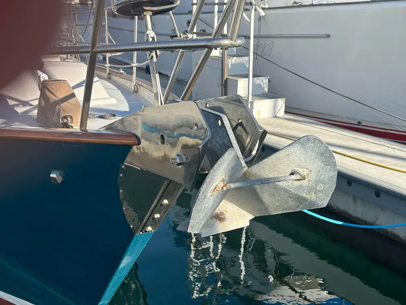 Slide: The Image of Sailboat anchor detail on a 1999 Passport Royal 43, docked in a marina. - 6