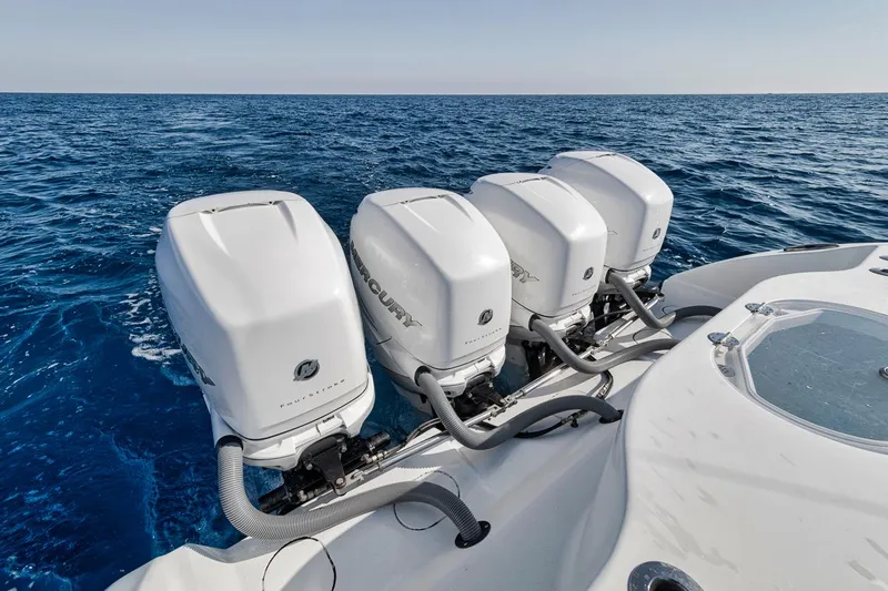 Slide: The Image of 2020 Yellowfin 42 Offshore boat with four powerful outboard engines on open sea. - 14