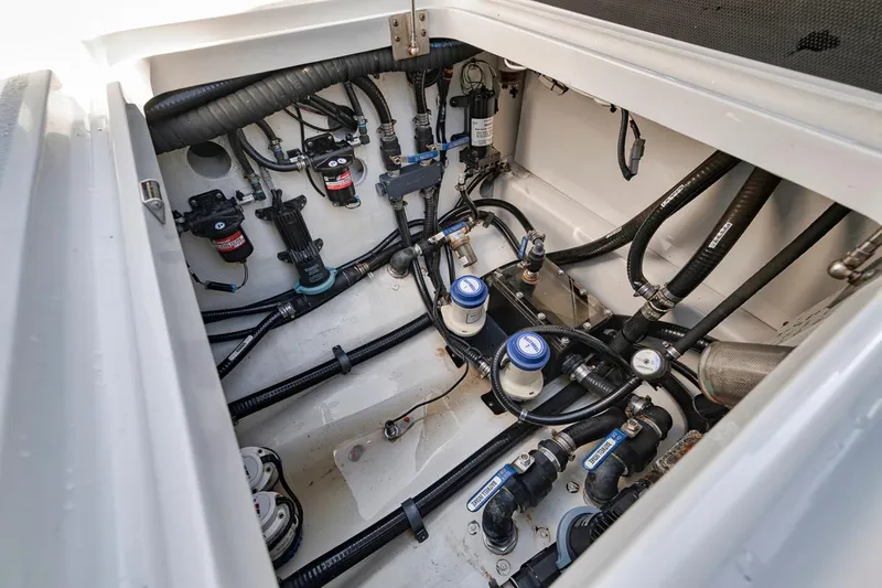 Slide: The Image of Engine compartment of a 2020 Yellowfin 42 Offshore boat, showcasing detailed wiring and components. - 17