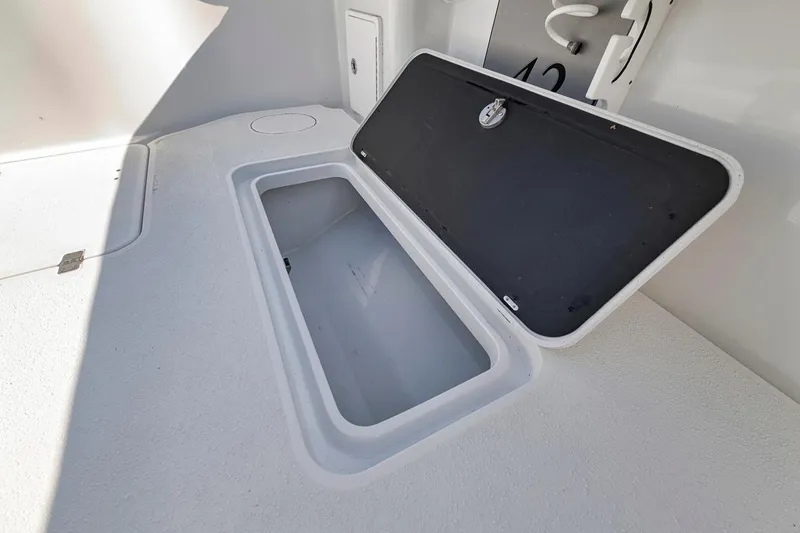Slide: The Image of Open storage compartment on 2020 Yellowfin 42 Offshore boat deck. - 21