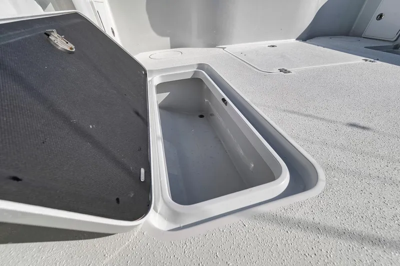 Slide: The Image of Open storage compartment on 2020 Yellowfin 42 Offshore boat deck. - 22