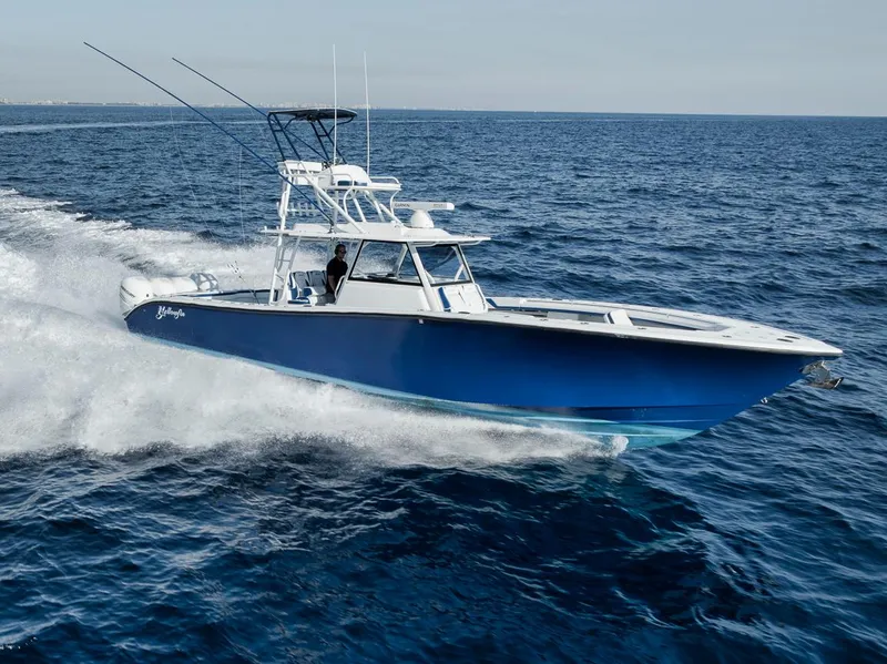 Slide: The Image of 2020 Yellowfin 42 Offshore boat cruising on open ocean waters. - 3