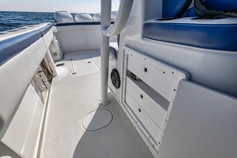 Slide: The Image of 2020 Yellowfin 42 Offshore boat interior with seating and storage compartments. - 30