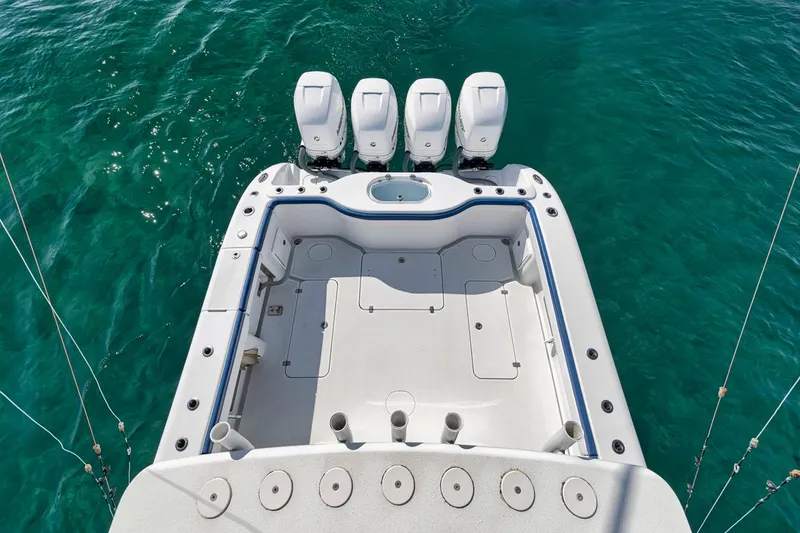 Slide: The Image of 2020 Yellowfin 42 Offshore boat with four engines on turquoise water. - 37