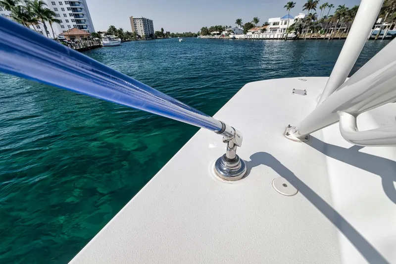 Slide: The Image of 2020 Yellowfin 42 Offshore boat on clear water, featuring a taut blue line. - 38