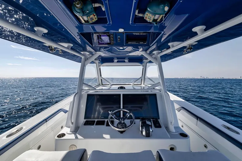 Slide: The Image of 2020 Yellowfin 42 Offshore boat interior with ocean view and modern dashboard. - 39