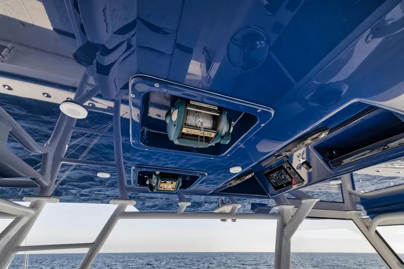 Slide: The Image of 2020 Yellowfin 42 Offshore boat interior with blue ceiling and equipment. - 44
