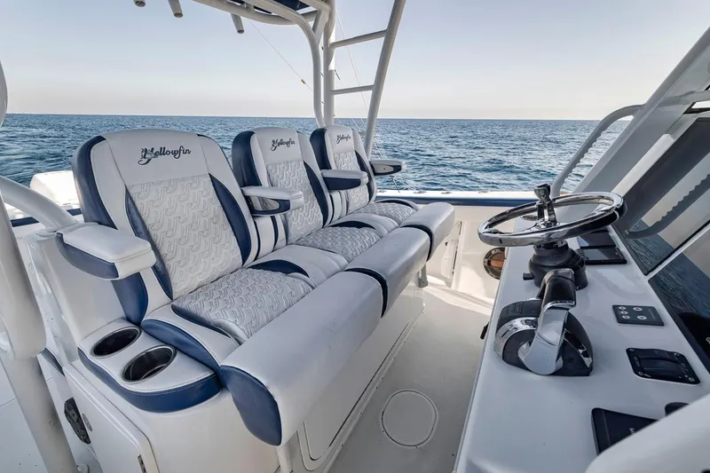 Slide: The Image of 2020 Yellowfin 42 Offshore boat interior with luxury seating and ocean view. - 46