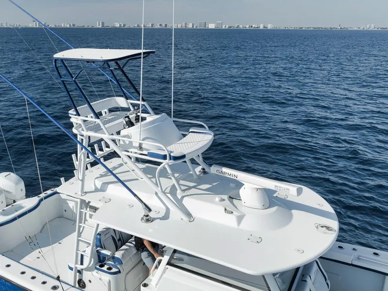 Slide: The Image of 2020 Yellowfin 42 Offshore boat with elevated helm, cruising on open water. - 5