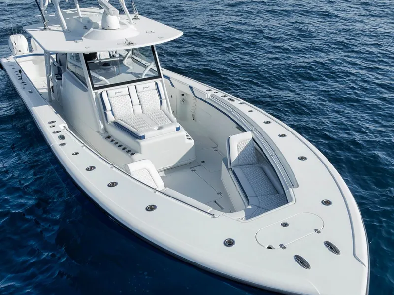 Slide: The Image of 2020 Yellowfin 42 Offshore boat on open water, showcasing sleek design and spacious deck. - 8