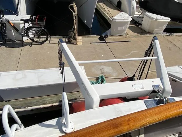 Slide: The Image of 1971 Matthews Motor Yacht docked, featuring deck equipment and nearby bicycles. - 2