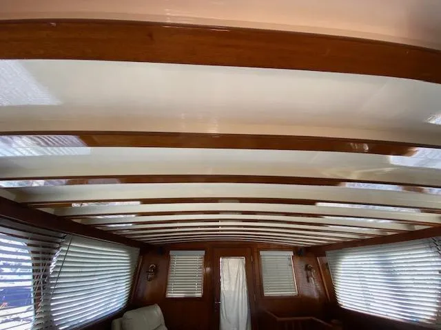 Slide: The Image of Interior of 1971 Matthews Motor Yacht with wooden beams and window blinds. - 20