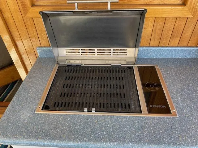 Slide: The Image of Kenyon grill on 1971 Matthews Motor Yacht, set in blue countertop. - 3