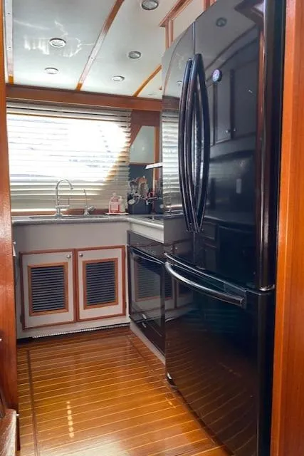 Slide: The Image of 1971 Matthews Motor Yacht kitchen with modern appliances and wood flooring. - 31