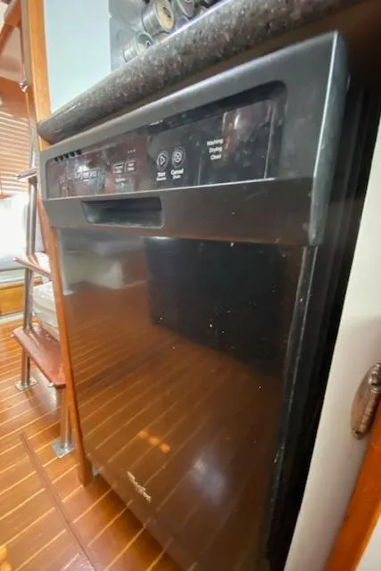 Slide: The Image of Black dishwasher in 1971 Matthews Motor Yacht kitchen interior. - 34