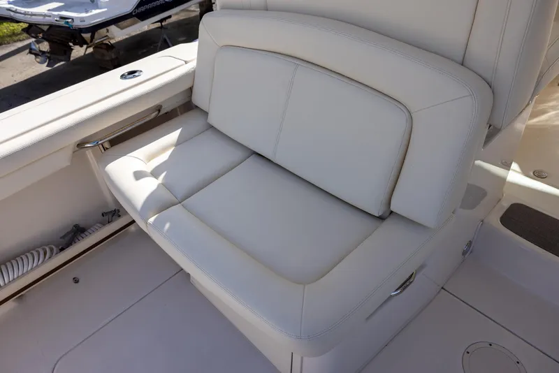 Slide: The Image of 2019 Grady-White Freedom 375 boat seat, white upholstery, outdoor setting. - 10