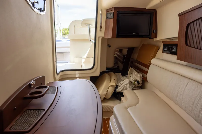 Slide: The Image of 2019 Grady-White Freedom 375 cabin interior with seating and wooden accents. - 15