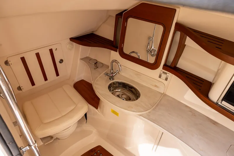 Slide: The Image of Luxurious 2019 Grady-White Freedom 375 boat bathroom with sink, mirror, and seating. - 16