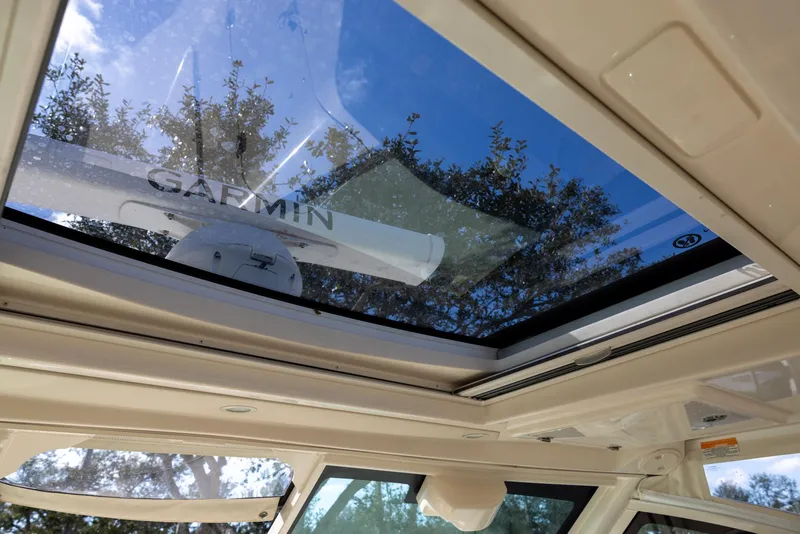 Slide: The Image of 2019 Grady-White Freedom 375 boat with Garmin radar through sunroof. - 22