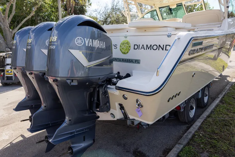 Slide: The Image of 2019 Grady-White Freedom 375 boat with Yamaha outboard motors, parked on a trailer. - 5