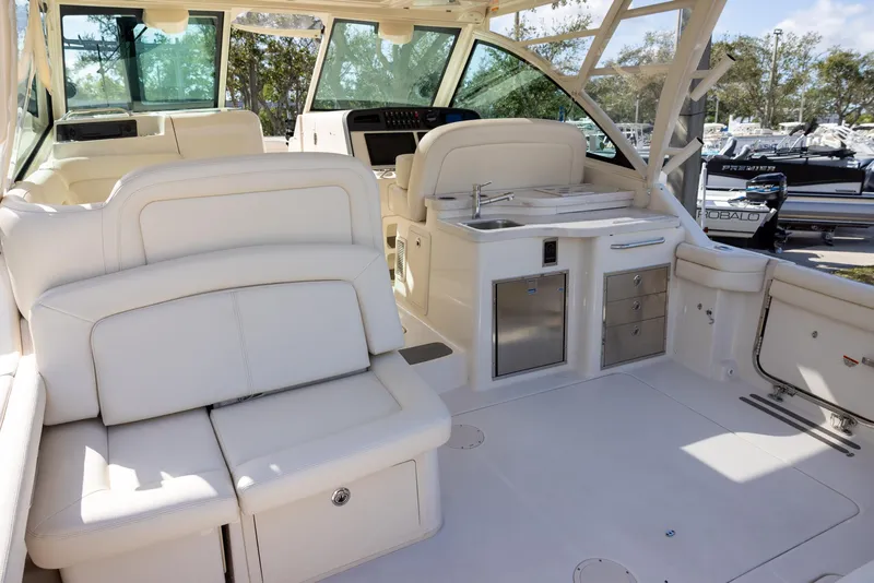 Slide: The Image of 2019 Grady-White Freedom 375 boat interior with luxurious seating and modern amenities. - 6
