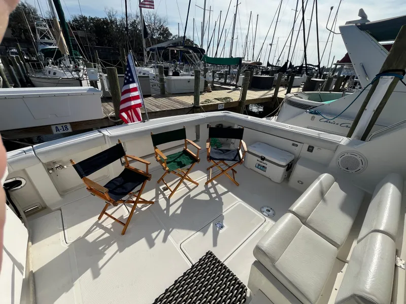 Slide: The Image of 2001 Tiara Yachts 4100 Open deck with chairs, docked at marina. - 13
