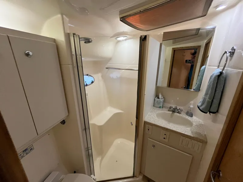 Slide: The Image of Bathroom interior of 2001 Tiara Yachts 4100 Open, featuring shower and vanity. - 35