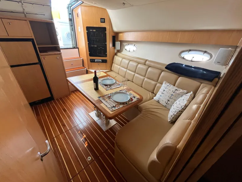 Slide: The Image of Interior of 2001 Tiara Yachts 4100 Open with elegant seating and dining area. - 40