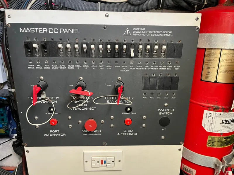 Slide: The Image of Master DC panel on a 2001 Tiara Yachts 4100 Open, featuring switches and circuit breakers. - 42
