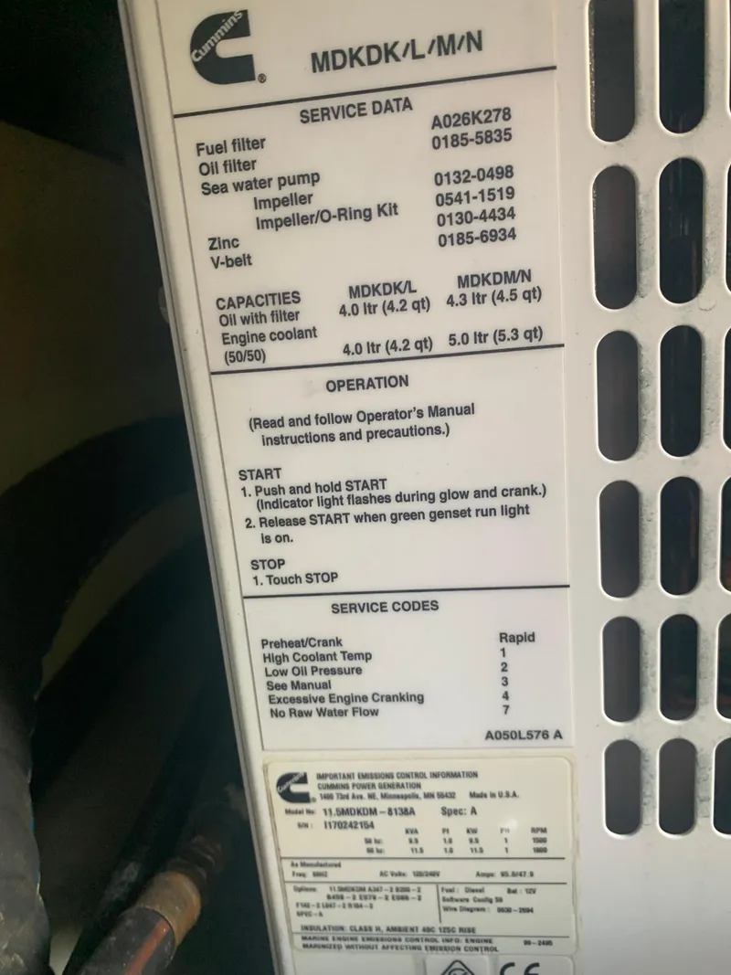 Slide: The Image of Close-up of Cummins engine service data and operation instructions on a 2001 Tiara Yachts 4100 Open. - 46